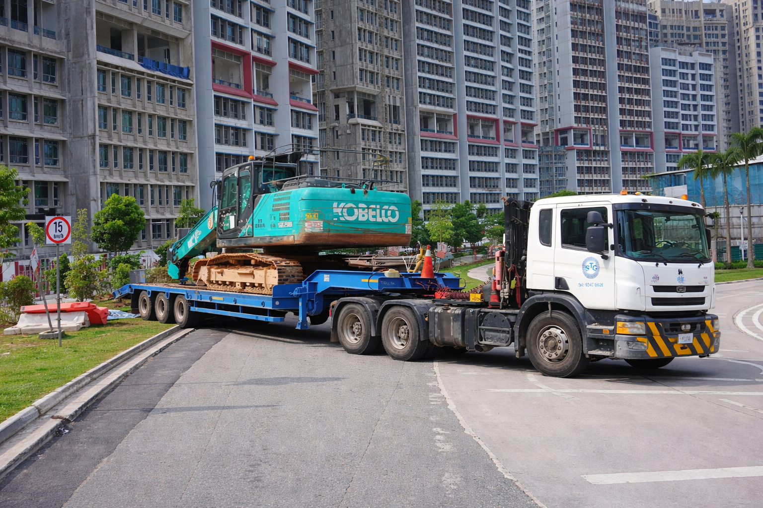 Heavy duty truck with Kobelco excavator